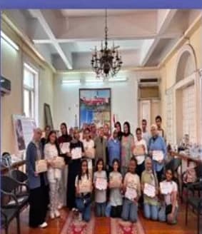Students holding certificates in the district hall
